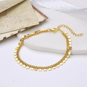 Minimalist gold plated brass bracelet with dangling tiny heart charms and lobster clasp