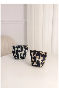 Detail of cute giraffe jacquard canvas pouches with H & R BAG woven label