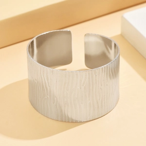 Vintage wide C-shaped stainless steel cuff bracelet with irregular bark texture in silver