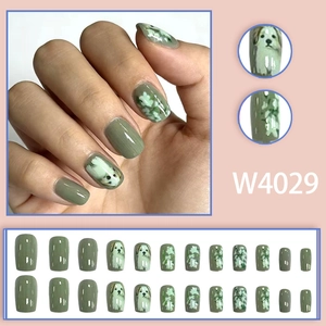Cute Morandi green press-on nails featuring floral and puppy motifs in 24-piece set