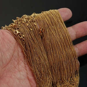 Macro shot of 18K gold-plated stainless steel ball chain necklaces with lobster clasp
