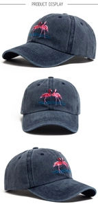 Detailed views of washed cotton baseball cap with embroidered pink flamingo patterns