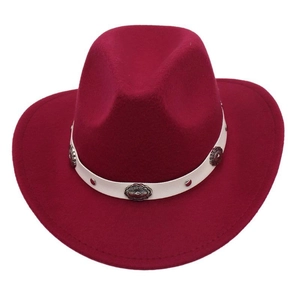 Macro view of burgundy western cowboy hat featuring white leather band and metal conchos