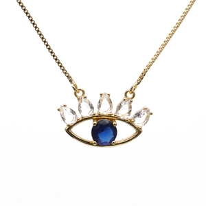 Elegant gold evil eye necklace with blue zircon and teardrop crystals on white background