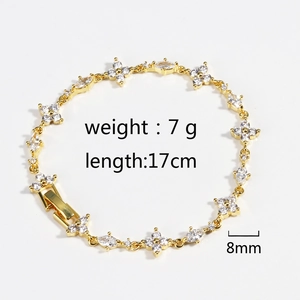 Macro shot showing 17cm length and 8mm width details of golden clover zircon bracelet