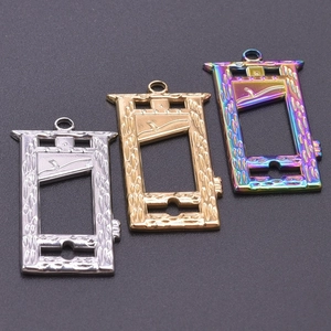 Detailed top view of guillotine-shaped DIY pendants in silver, gold, and rainbow colors