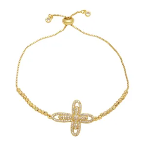 Elegantes Goldkreuz Armband mit glitzernden Zirkoniasteinen und verstellbarem Zugverschluss