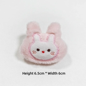 Detail view of plush pink rabbit brooch with embroidery, size 6.5cm x 6cm for accessories