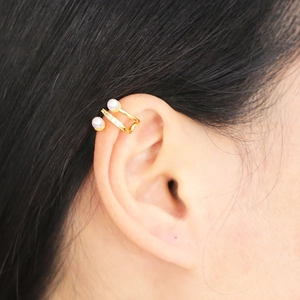 Elegant gold double-layer ear cuff with white pearls and micro-pave cubic zirconia accents