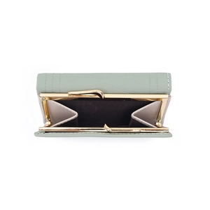 Detail of light green leather wallet showing the golden metal clasp coin pocket and lining