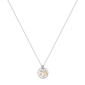 Detail of silver round pendant with geometric cutouts and colored gemstones on an O-chain