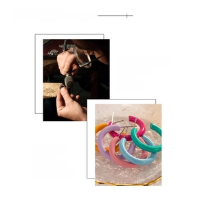Detail of 18K gold plated C-shaped hoops showing vibrant colors and hand-polished finish