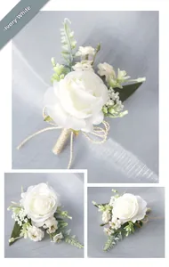 Detail of ivory white artificial rose boutonniere with green leaves and hemp rope handle