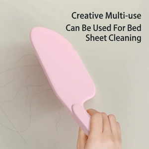 Pink multifunctional mattress elevator tool for tucking sheets and removing hair easily