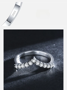 Macro shot of S925 sterling silver stamp and V-shaped pave cubic zirconia ring band