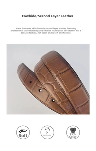 Macro shot of brown split cowhide leather belt featuring embossed crocodile texture and stitching