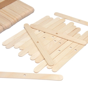 Detailed macro view of natural wooden popsicle sticks with pre-drilled round holes for DIY