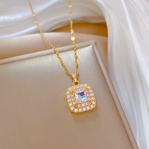 Luxurious gold titanium necklace with a square pink and white zircon pendant shown at 45 degrees