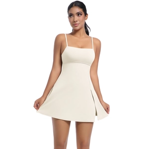 Detail of cream tennis dress featuring thin straps and stylish high side slit design