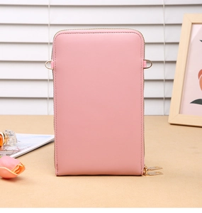 Detail view of the pink faux leather crossbody bag with elegant golden double zippers