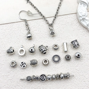 Assorted silver Tibetan style spacers and floral charms for DIY jewelry making