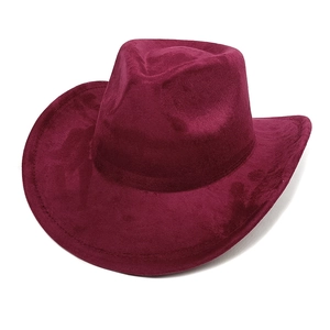 Close-up of the burgundy suede texture and wide brim of this classic cowboy fedora hat