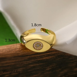 Detail view of gold geometric evil eye ring with dimensions and weight measurements