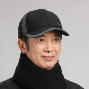 Detail of winter baseball cap for men with ear flaps and metal sport lettering