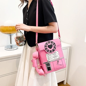 Pink retro telephone shoulder bag with shiny PU finish and creative dial design detail
