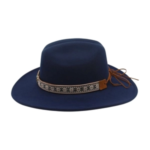 Detail of navy blue wool felt fedora featuring ethnic embroidery and leather tassel