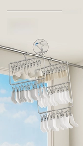 Detail of stainless steel drying rack with clips and windproof hook for socks and underwear