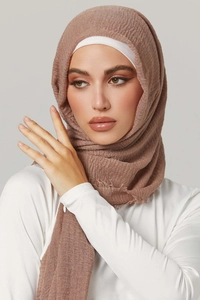 Detailed view of dust rose pleated cotton hijab with a matching white stretch inner cap