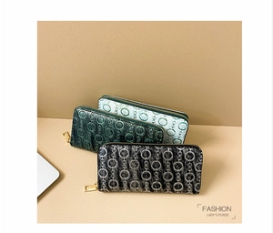 Group display of long embossed PU leather purses in black, green, and light blue with gold zippers