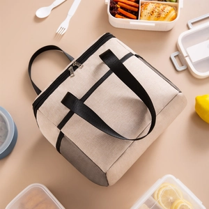 Beige large insulated Oxford cloth lunch bag with reinforced handles and side mesh pocket