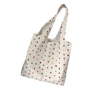 Minimalist white tote bag with colorful polka dots and long shoulder straps for shopping