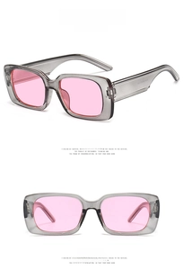 Detail view of square sunglasses with transparent grey frame and pink lenses from multiple angles