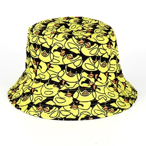 Detailed pattern of yellow cotton bucket hat featuring various cartoon ducks print