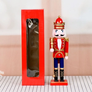 Classic 36cm wooden nutcracker soldier with crown and scepter next to its red gift box