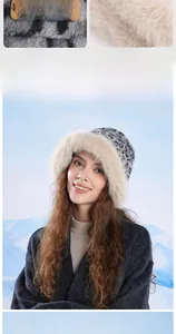 Detail of winter leopard print bucket hat with plush faux fur trim and leather branding