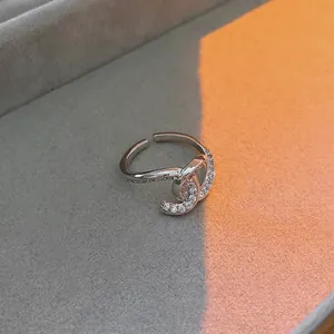 Luxury silver-toned open ring featuring a double-C zircon paved irregular heart design