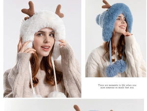 Detail of plush reindeer antler hat with earflaps and pom-poms in white and blue