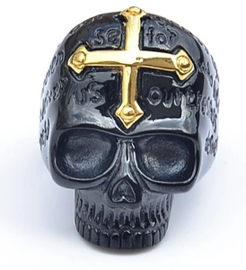 Macro detail of gothic skull ring with golden cross and engraved scripture on band