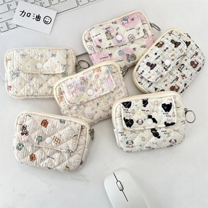 Quilted cotton mini card holders featuring cute cartoon patterns and zipper closures