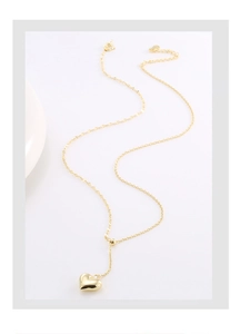 Detail of adjustable golden heart pendant necklace with sliding bead and S925 silver lobster clasp