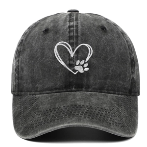 Close-up of white heart and paw embroidery on washed cotton baseball cap texture