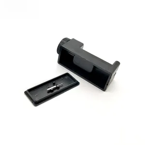 Detailed view of black watch band link remover tool with adjustment base and metal pin