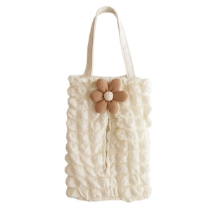 Detail of cream puff fabric car tissue holder with brown floral accent and handle