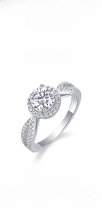 Macro detail of moissanite halo ring with split shank in 925 silver and 18K gold finish