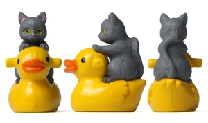 Three-angle views of a grey cat figurine riding a yellow rubber duck for miniature gardening