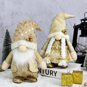 Golden Christmas gnomes with sequins and snowflake patterns in a snowy winter scene